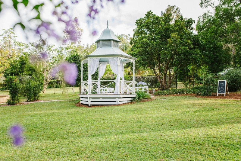Open lawn and gardens with the white rotunda